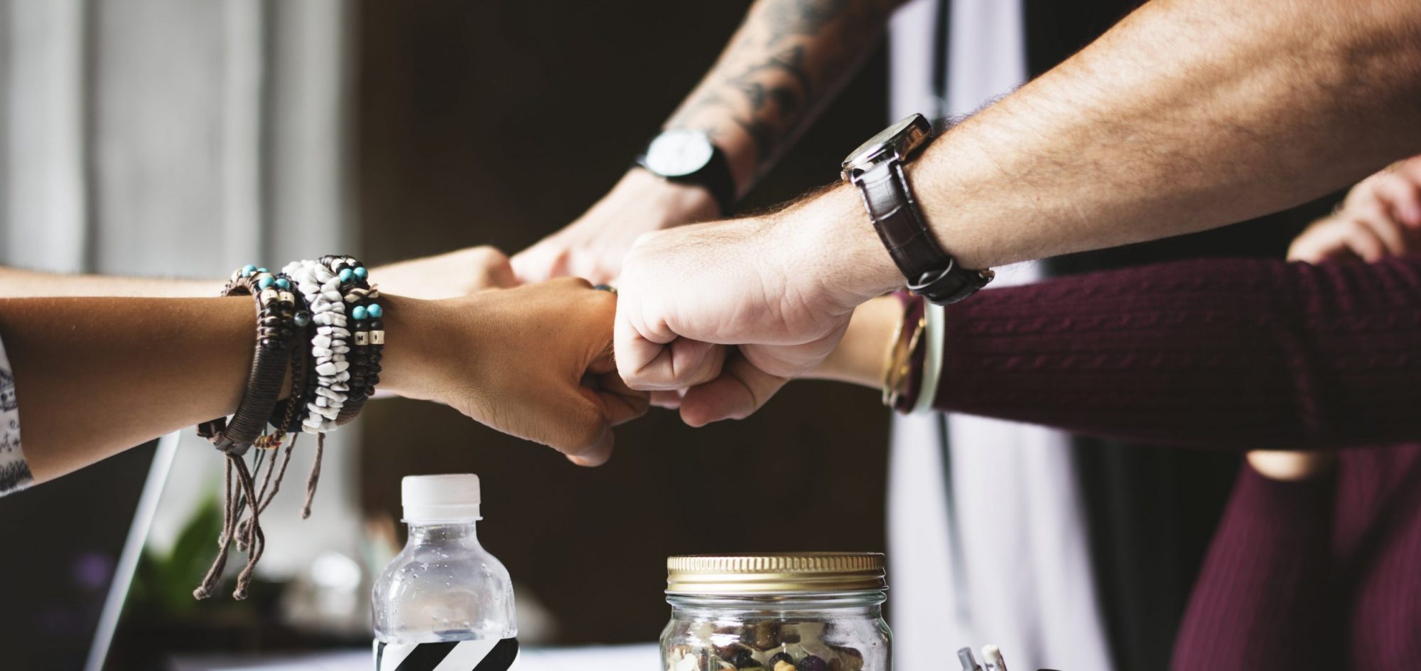 cropped-fistbump-over-desk-scaled-3.jpg